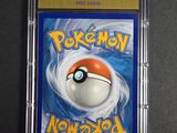 a close up of a pokemon card in a plastic case