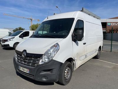 a white van parked in a parking lot with other vehicles