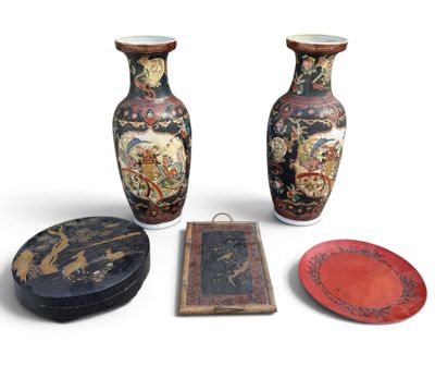 three vases and a plate are sitting next to each other