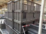 a large metal crate sitting in the middle of a warehouse