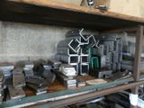 a shelf full of metal items on a wooden table