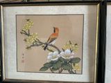 a picture of a bird sitting on a branch of a tree