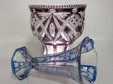 a blue and white vase and a blue and white vase on a white surface