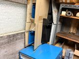 a blue box that is sitting in the corner of a room