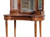a small wooden table with a mirror on top of it
