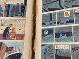 two pages from a comic book on a table