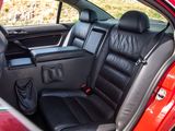 a red car with black leather seats in the back of it