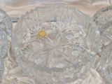 a lot of glass dishes on a white cloth