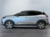 a silver suv parked in a garage with a white wall