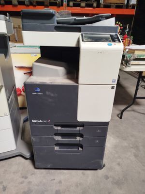 a printer that is sitting on the floor next to a printer