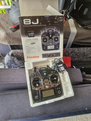a box with a remote control sitting on top of a couch