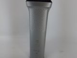 a shaver that is sitting on a white surface