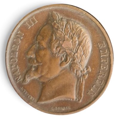 une vieille pièce de bronze sur laquelle figure le portrait d'un homme