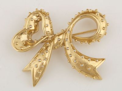 yellow gold tone bow brooch with rhines and pearls