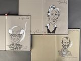 several drawings of people are shown on a book on a table