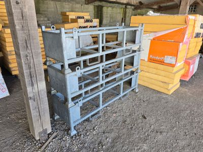 many crates of different sizes and colors in a warehouse