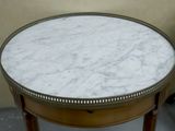 a marble top table with a wooden base