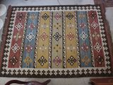 a rug on the floor next to bowls of food