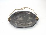an old metal tray with a picture of a castle on it
