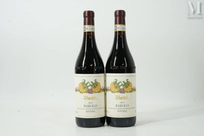 two bottles of wine sitting next to each other on a table