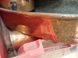 a metal pan sitting on top of a pink box