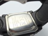 a close up of a watch on a white surface