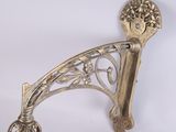 a silver candle holder with a candle inside of it
