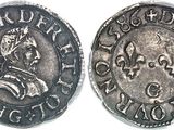 a close up of a coin with an image of a man on it