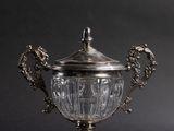 a silver cup that is sitting on a table