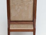 a chair with a seat made of wood and wicker