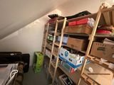 a room with a lot of boxes and boxes on the shelves
