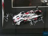 a picture of a race car with autographs on it