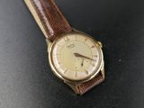 a close up of a wrist watch on a table