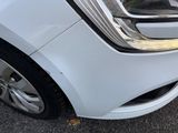 a close up of a car ' s headlight and front bumper