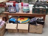 many boxes of items on a table in a store