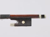 an image of a violin bow with a piece of wood sticking out of it