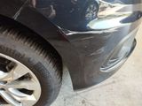 a close up of a car that has a denting on it