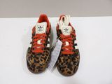 leopard print adidas sneakers with orange laces and white soles