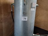 a water heater in the corner of a room