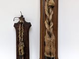 two wall plaques on the wall of a room