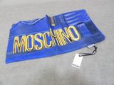 a blue shirt with a moschino logo on it