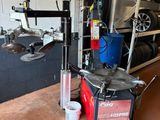 a machine that is sitting on a table in a garage