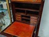 an old wooden desk with drawers and drawers on top of it