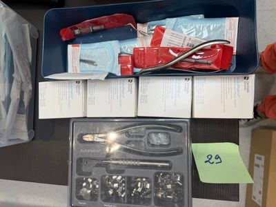 a box of tools sitting on a table next to a pair of shoes