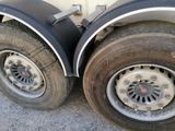 a close up of a flat tire on a truck