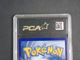 the card is in a plastic case on a black surface