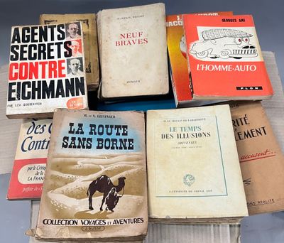 several books are stacked on top of each other on a table