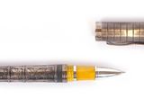 two pens sitting next to each other on a white surface