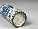 a blue and white vase sitting on a table