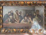 painting of a group of people sitting around a table in a room